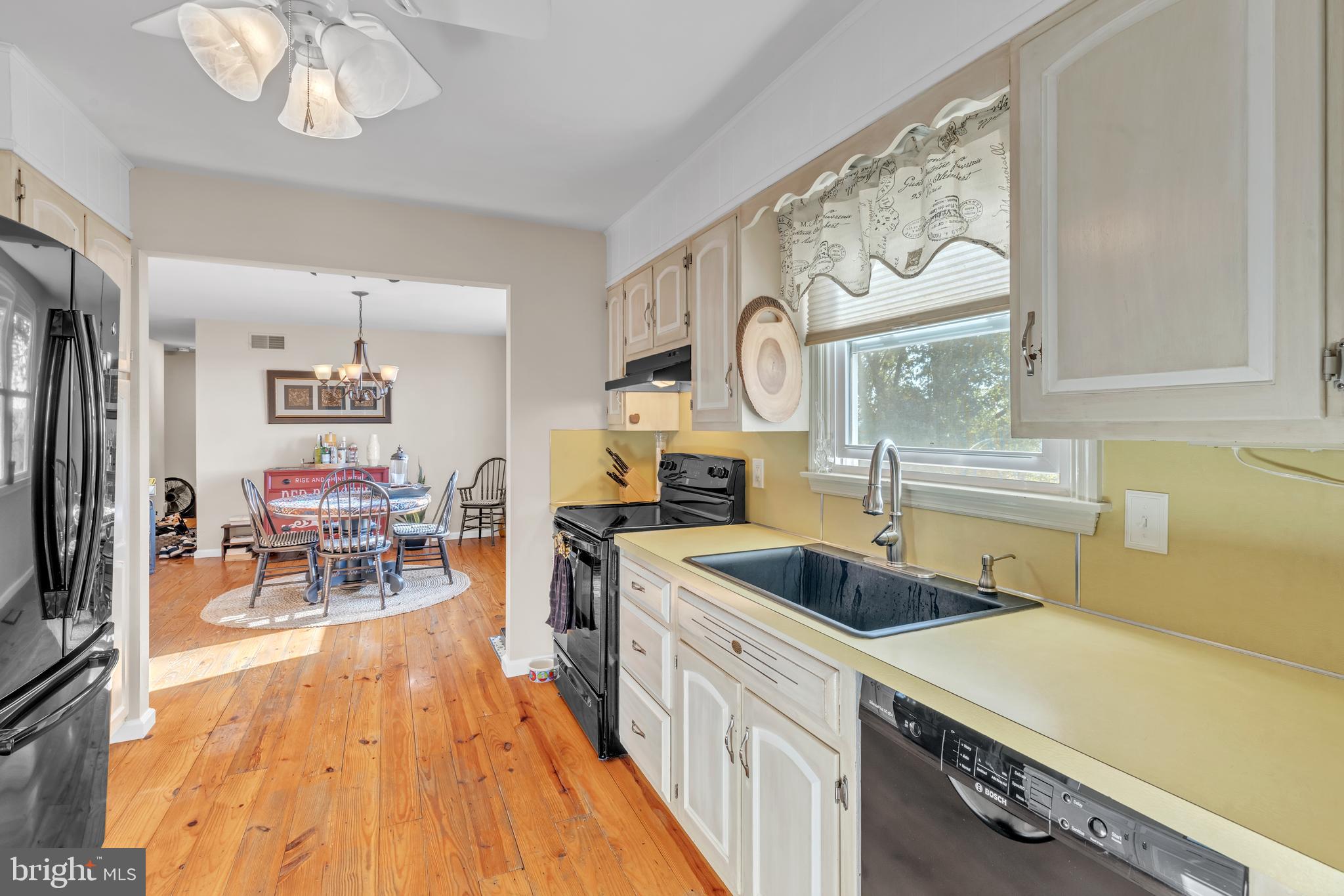 90 Upper Valley Road Christiana, PA 17509 - Photo 14 of 36 a kitchen with a sink a stove and cabinets