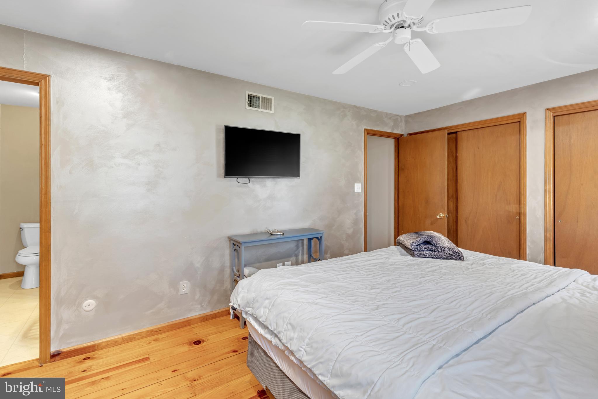 90 Upper Valley Road Christiana, PA 17509 - Photo 18 of 36 a bedroom with a bed and a flat screen tv
