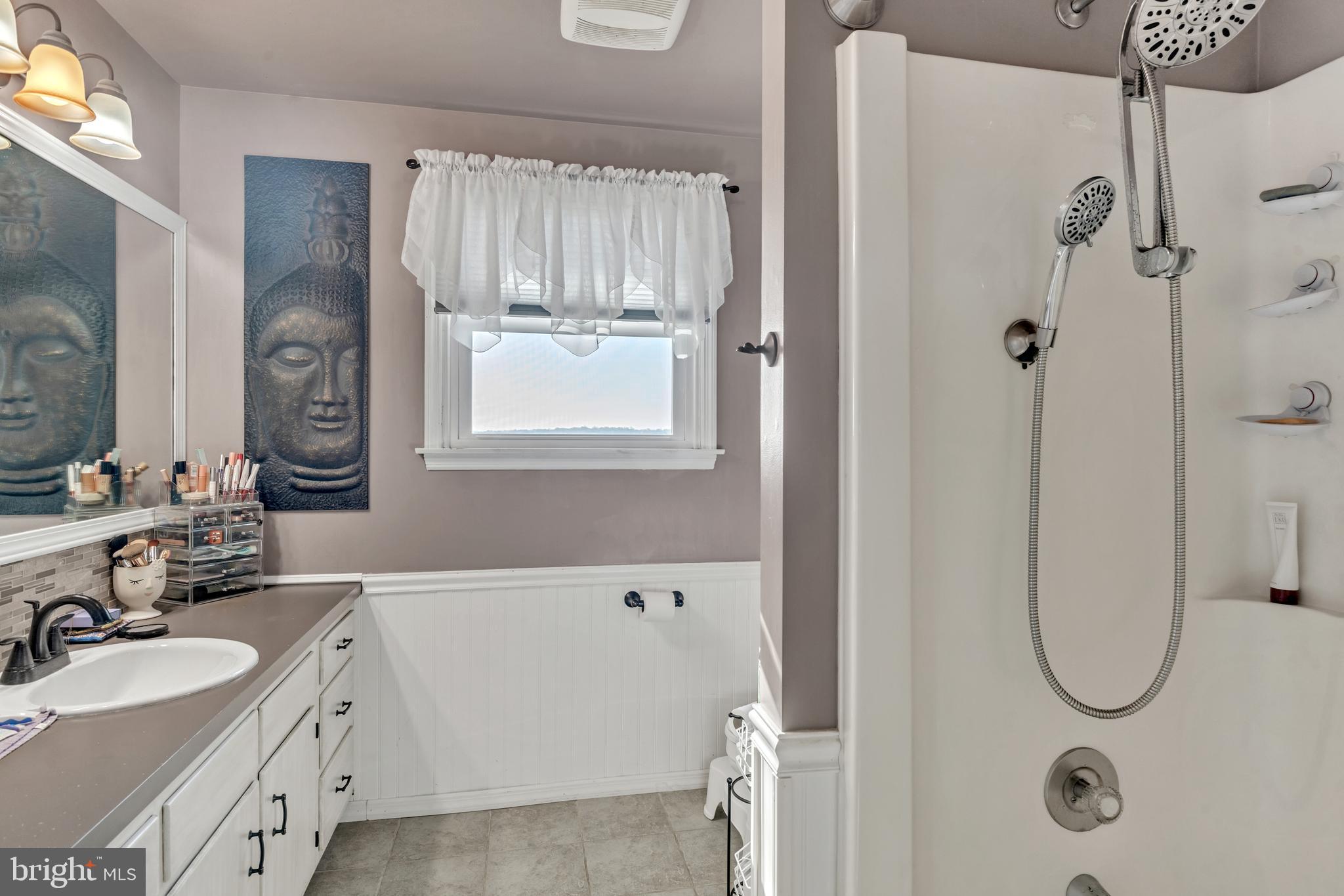 90 Upper Valley Road Christiana, PA 17509 - Photo 22 of 36 a bathroom with a granite countertop sink mirror and vanity