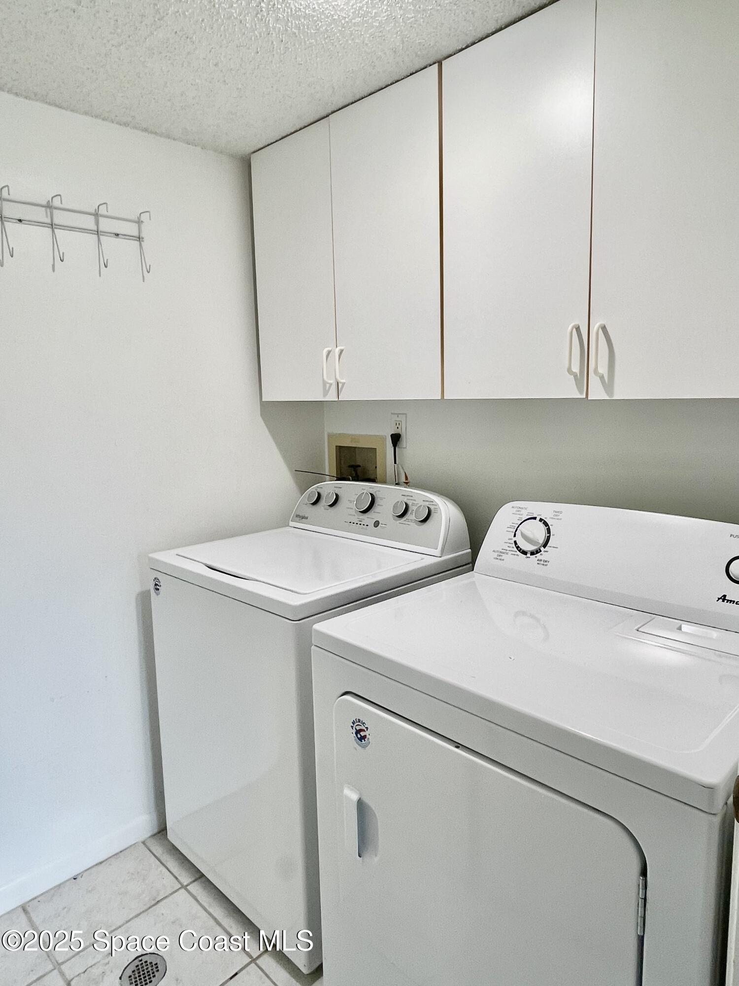 594 North Wickham Road, Unit 2 Melbourne, FL 32935 - Photo 14 of 42 a utility room with dryer and washer