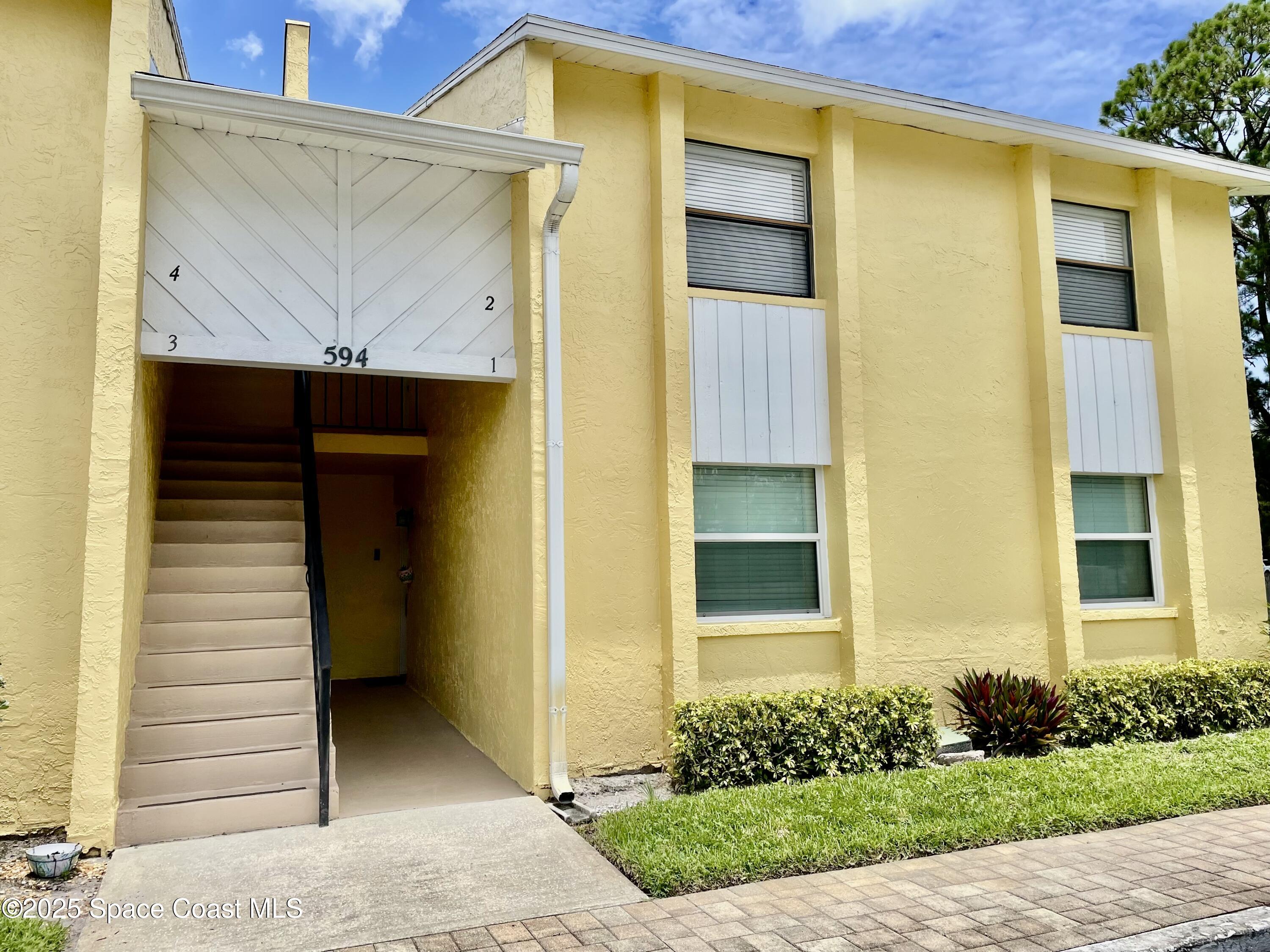 594 North Wickham Road, Unit 2 Melbourne, FL 32935 - Photo 2 of 42 a front view of a house