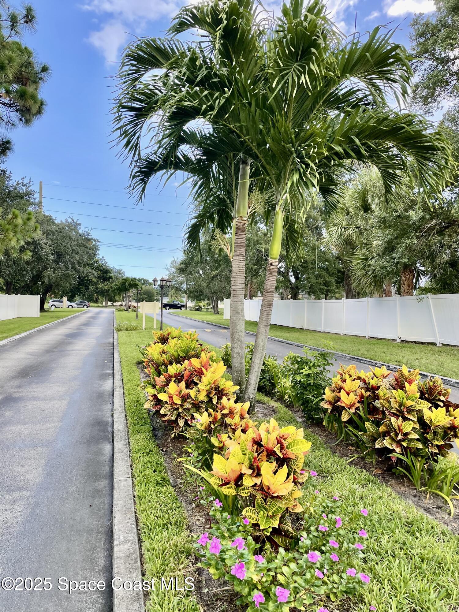 594 North Wickham Road, Unit 2 Melbourne, FL 32935 - Photo 30 of 42 a view of a garden with flowers