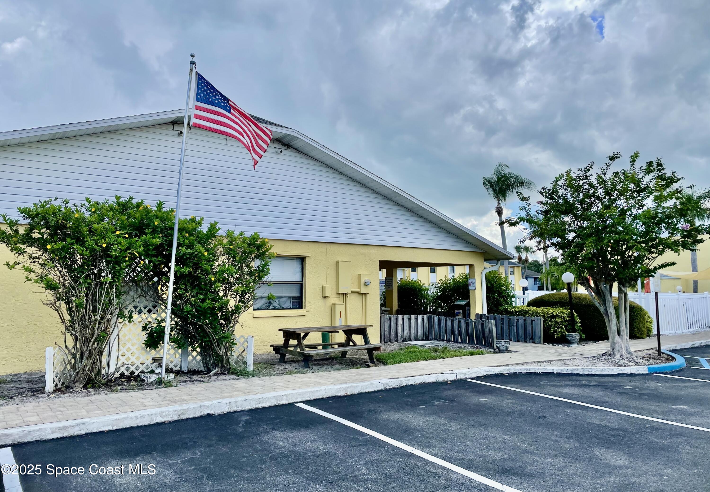 594 North Wickham Road, Unit 2 Melbourne, FL 32935 - Photo 34 of 42 a view of a house with a patio
