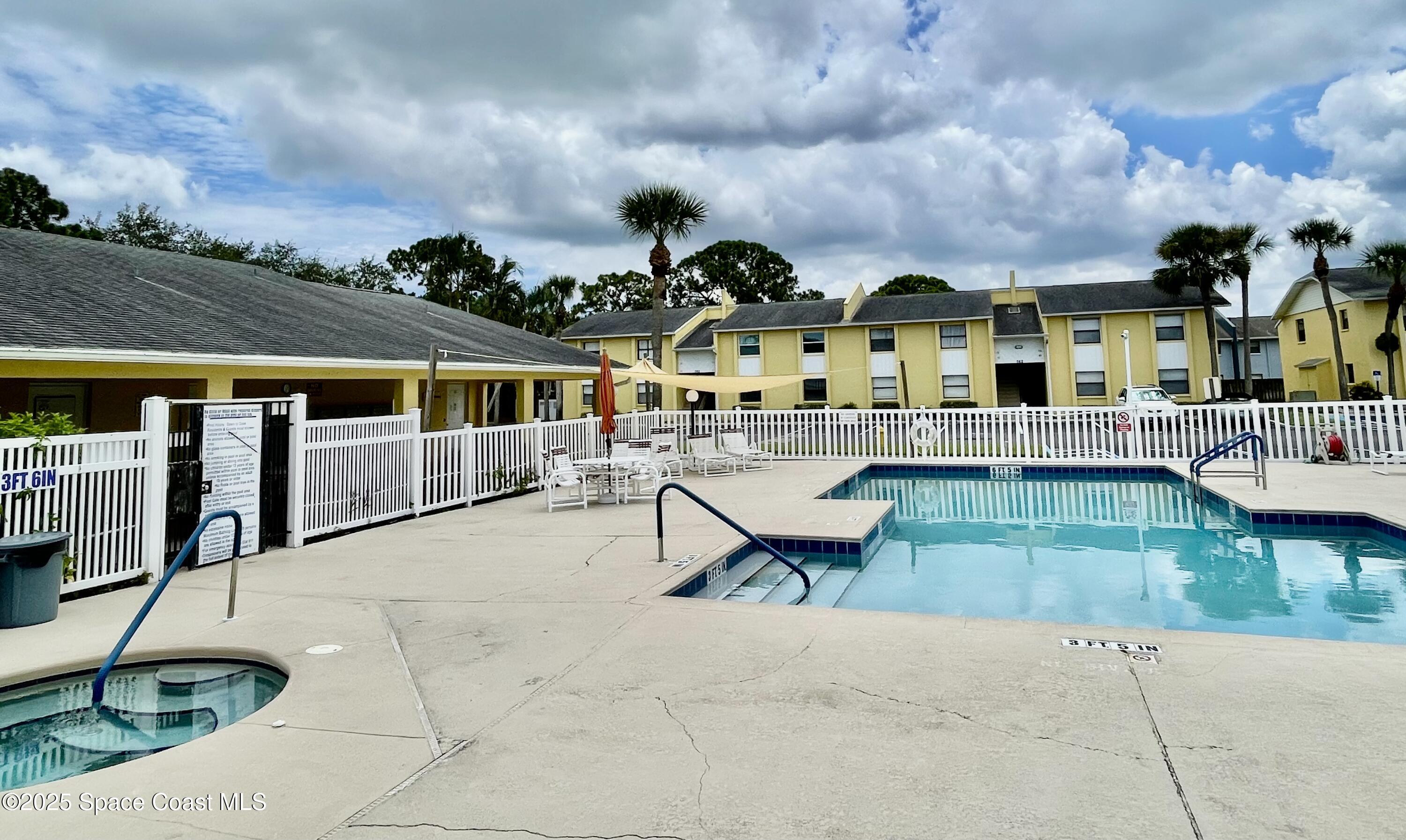 594 North Wickham Road, Unit 2 Melbourne, FL 32935 - Photo 35 of 42 a view of house with a garden and sitting area