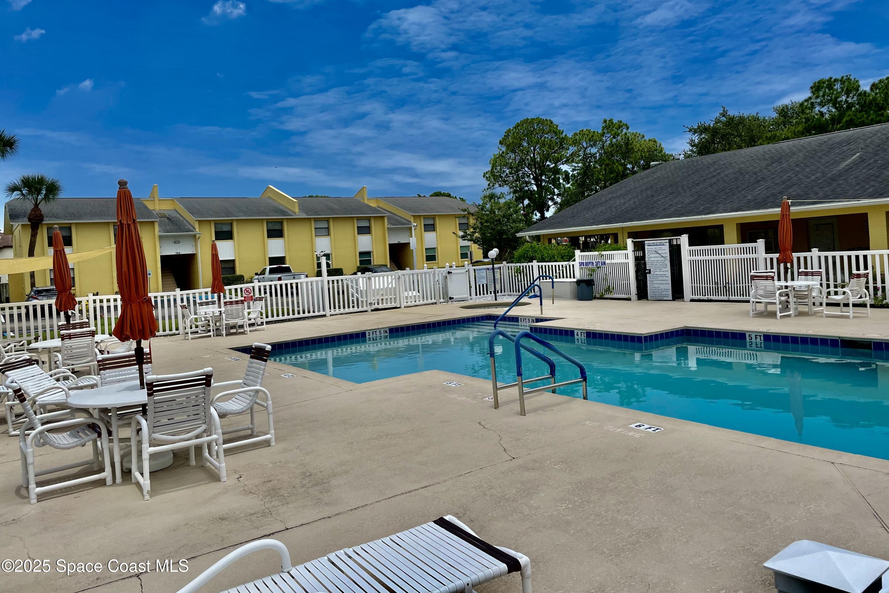 594 North Wickham Road, Unit 2 Melbourne, FL 32935 - Photo 37 of 42 an outdoor space with furniture and garden
