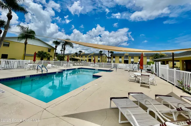 a view of a swimming pool with a patio