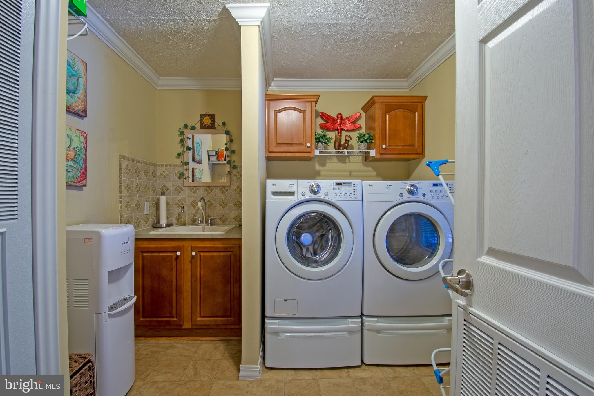 148 Bluebell Drive, Unit 75 Magnolia, DE 19962 - Photo 25 of 32 a view of a storage & utility room with washer and dryer