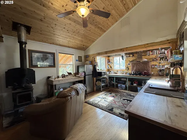 a room with lots of wooden furniture and a rug