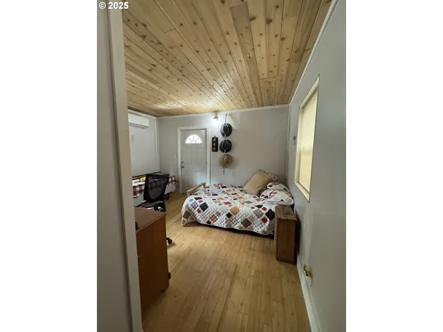 a bedroom with a bed and cabinets