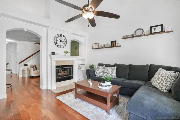 a living room with furniture and a fireplace