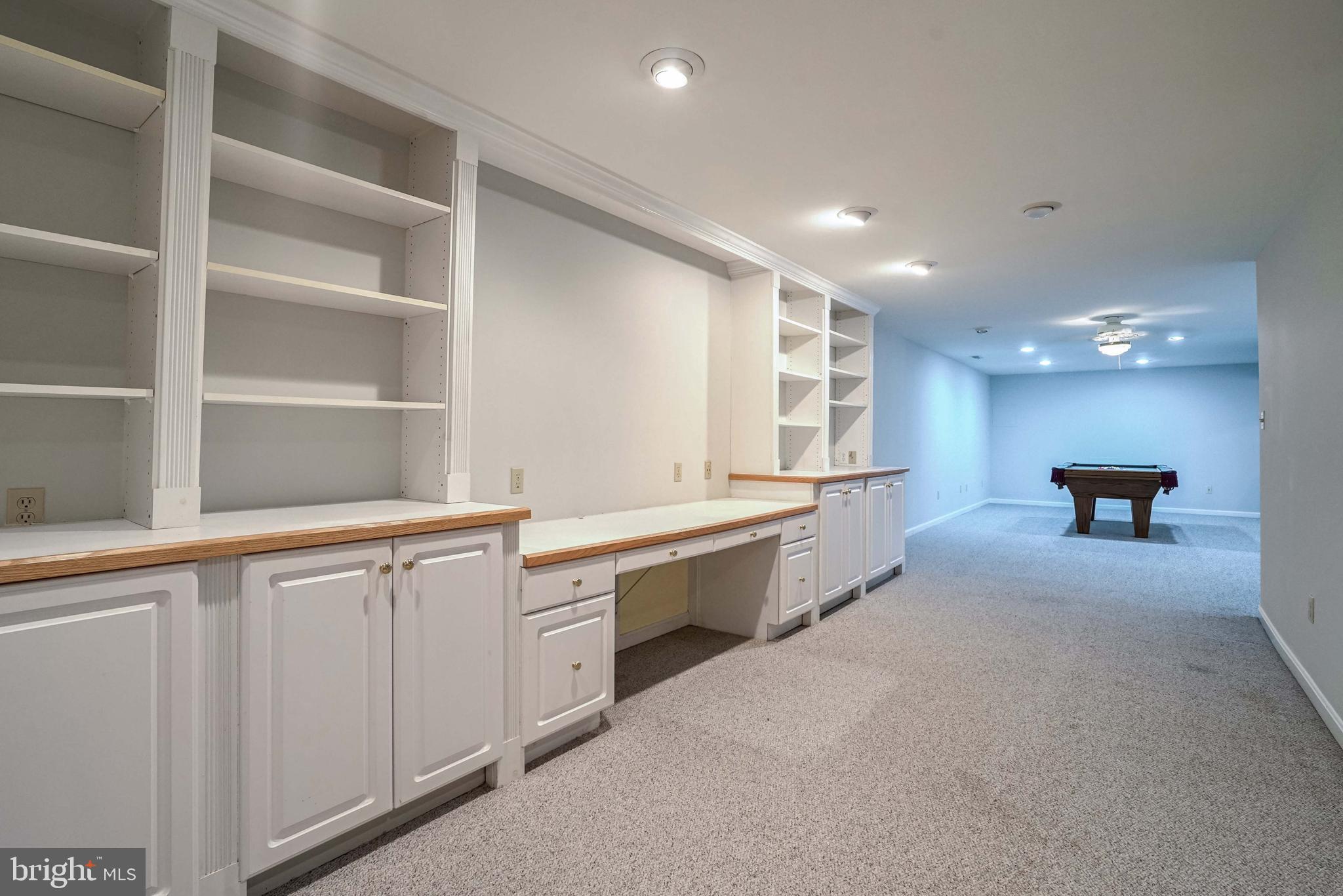 12388 Henderson Road Clifton, VA 20124 - Photo 35 of 47 Basement Built- In Bookshelves & Desk