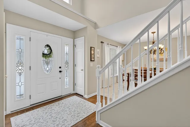 a view of an entryway with wooden floor