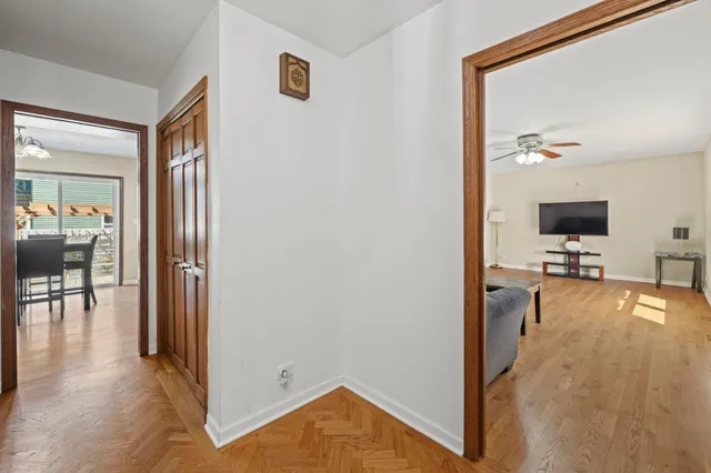 a view of a livingroom with furniture and a flat screen tv
