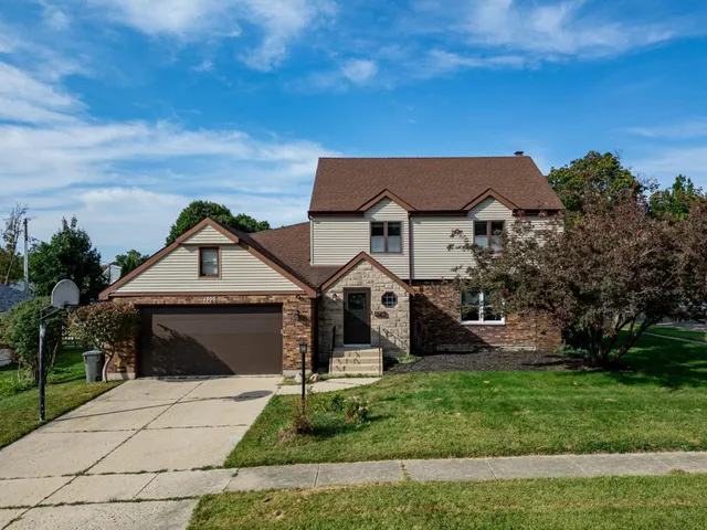 front view of a house with a garden