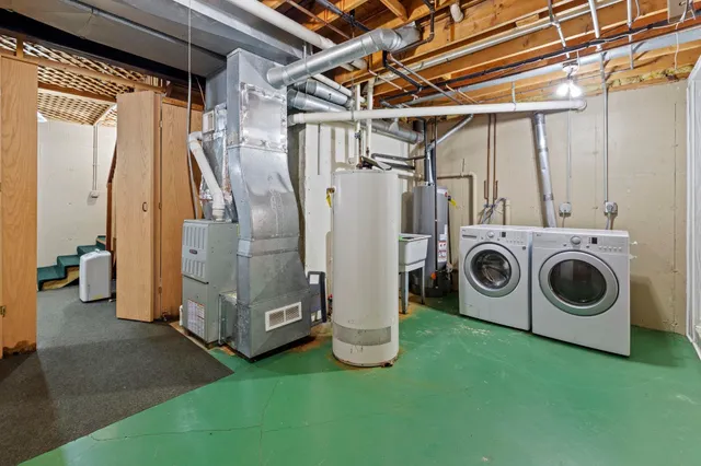 a view of bathroom with washer and dryer