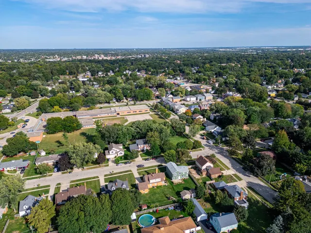 an aerial view of residential houses with outdoor space