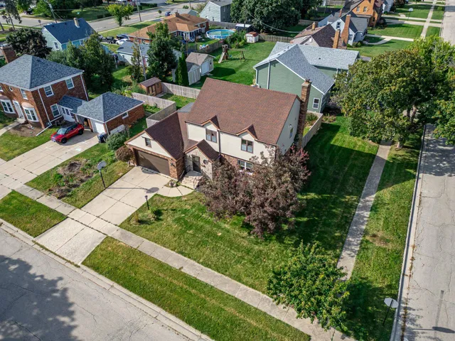 an aerial view of a house with garden