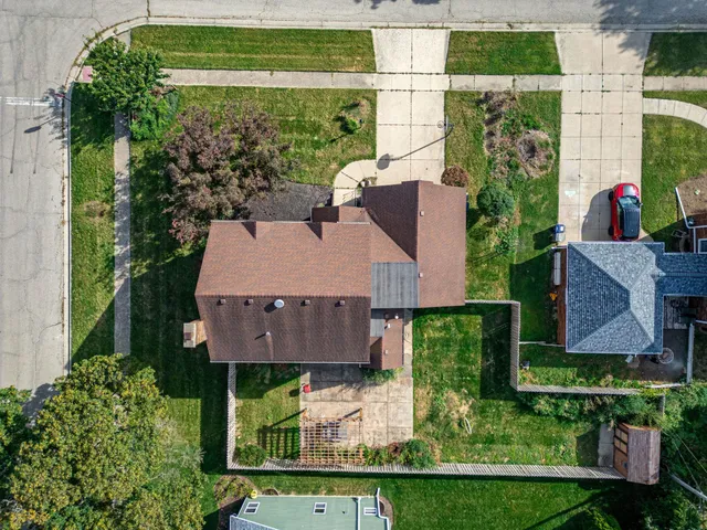 an aerial view of house with yard swimming pool and outdoor seating