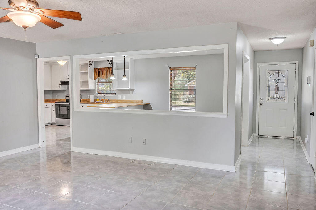 4712 Frontier Road Pace, FL 32571 - Photo 18 of 29 a view of a kitchen and window
