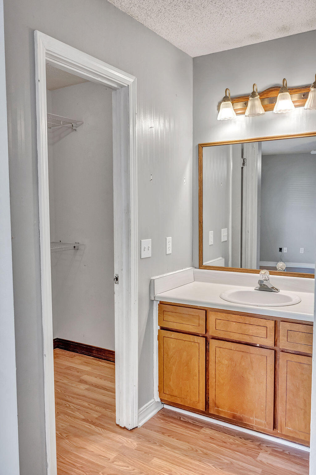 4712 Frontier Road Pace, FL 32571 - Photo 21 of 29 a bathroom with a sink and a mirror