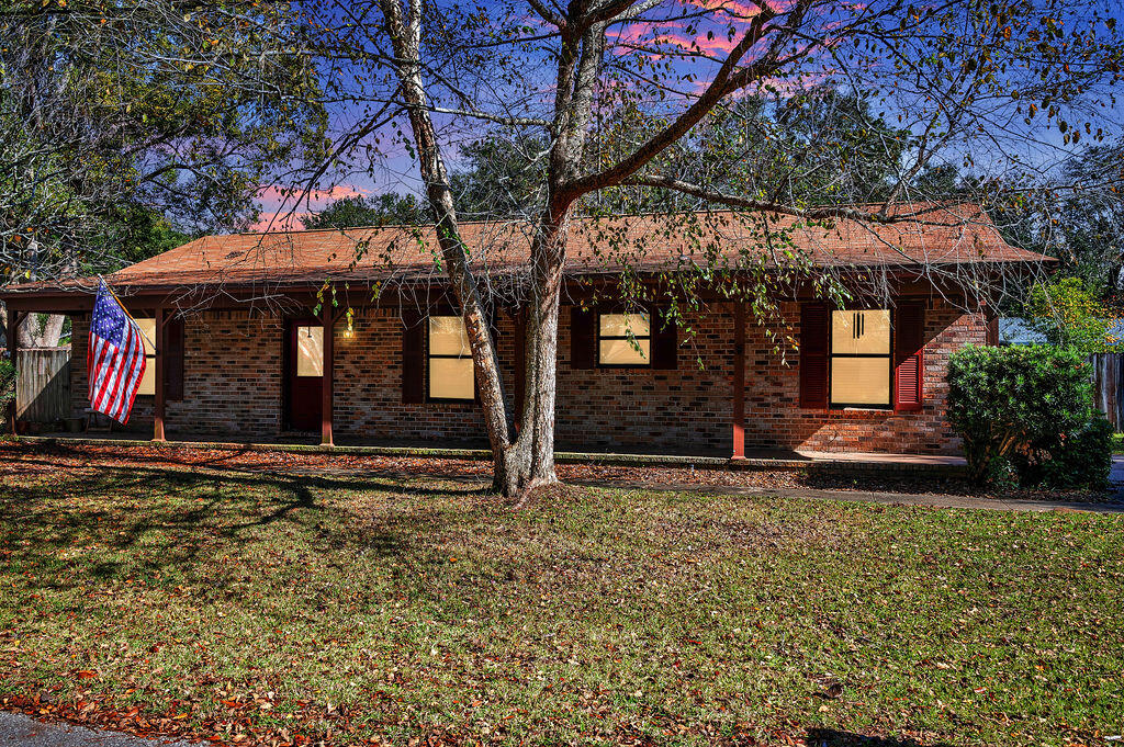 4712 Frontier Road Pace, FL 32571 - Photo 4 of 29 a view of a house with a yard