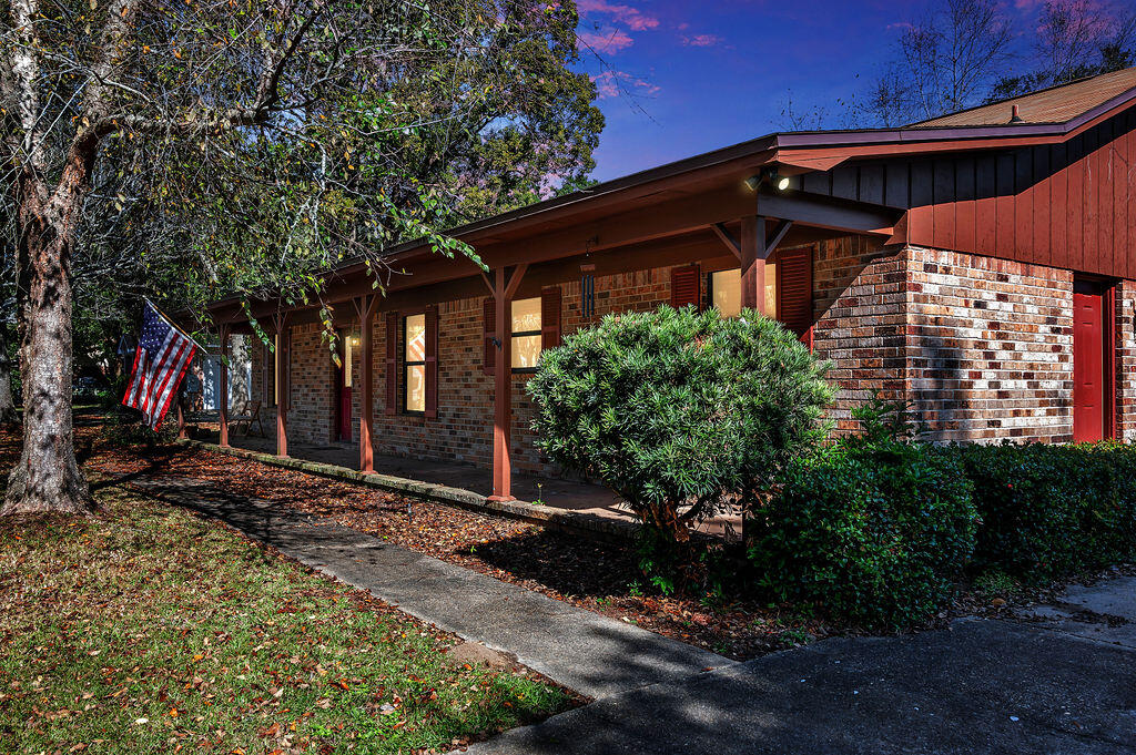 4712 Frontier Road Pace, FL 32571 - Photo 7 of 29 a view of a house with a small yard