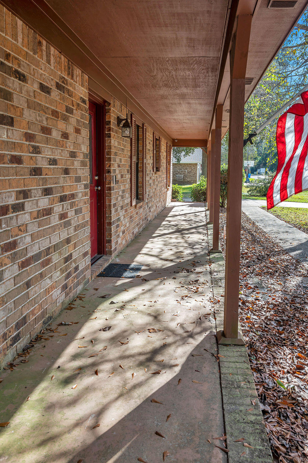 4712 Frontier Road Pace, FL 32571 - Photo 8 of 29 a view of a pathway along the wall