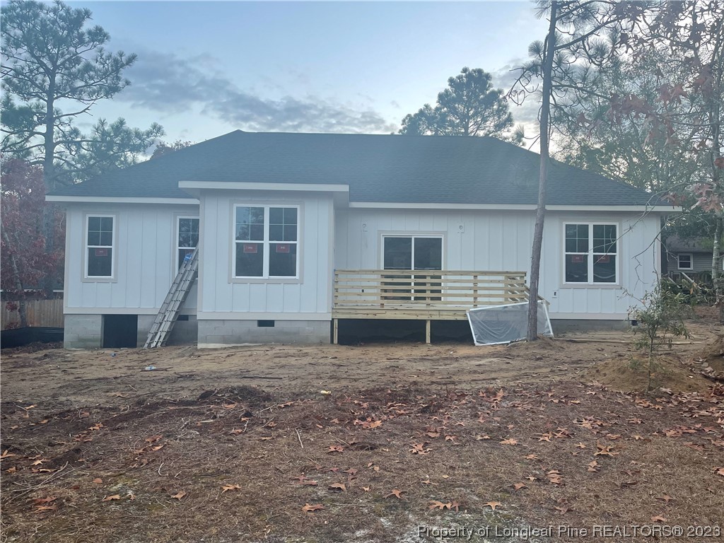 5 Gilmore Road Pinehurst, NC 28374 - Photo 17 of 19 a view of a house with a yard and garage