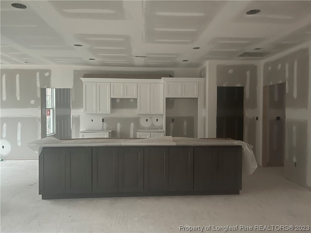 5 Gilmore Road Pinehurst, NC 28374 - Photo 4 of 19 a kitchen with stainless steel appliances granite countertop a refrigerator and a sink