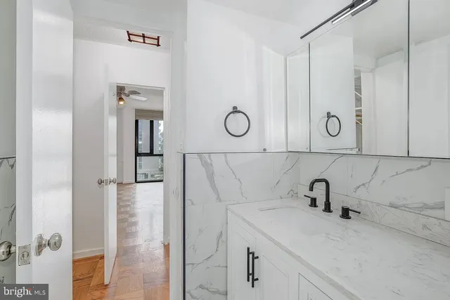 a white toilet sitting next to a shower curtain