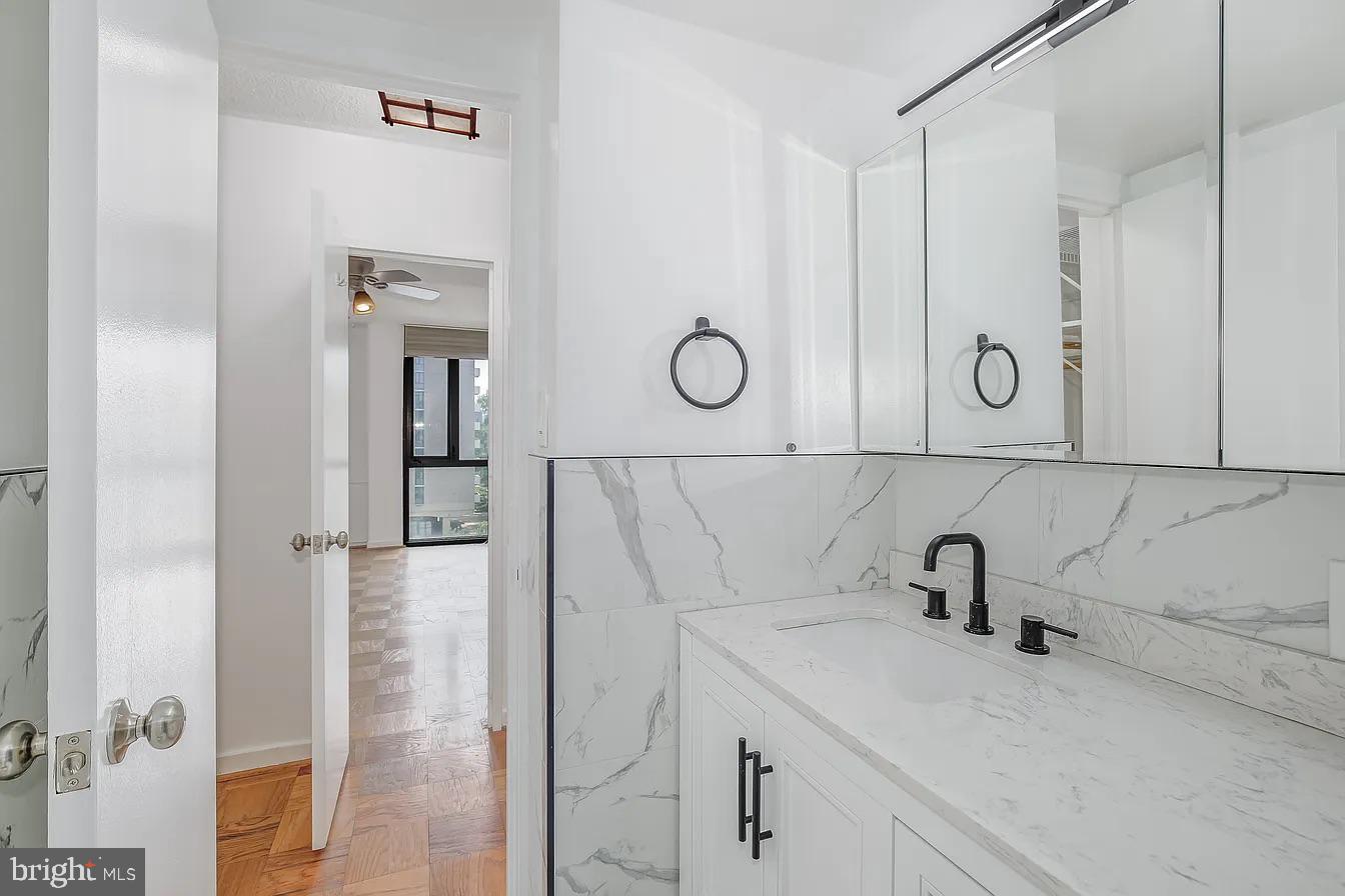 1250 4th Street Southwest, Unit W403 Washington, DC 20024 - Photo 11 of 30 a bathroom with a sink and a mirror