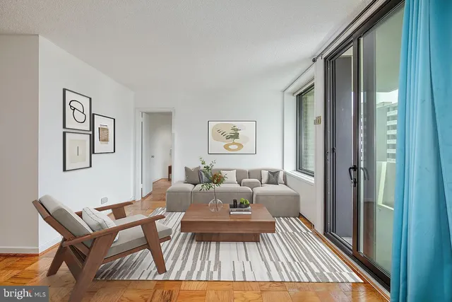 a living room with furniture and a table