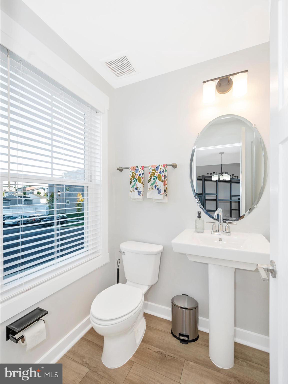 740 Tatum Court Frederick, MD 21702 - Photo 18 of 53 a bathroom with a toilet a sink and mirror