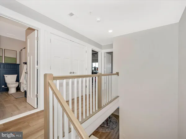 a utility room with dryer washer and a fireplace