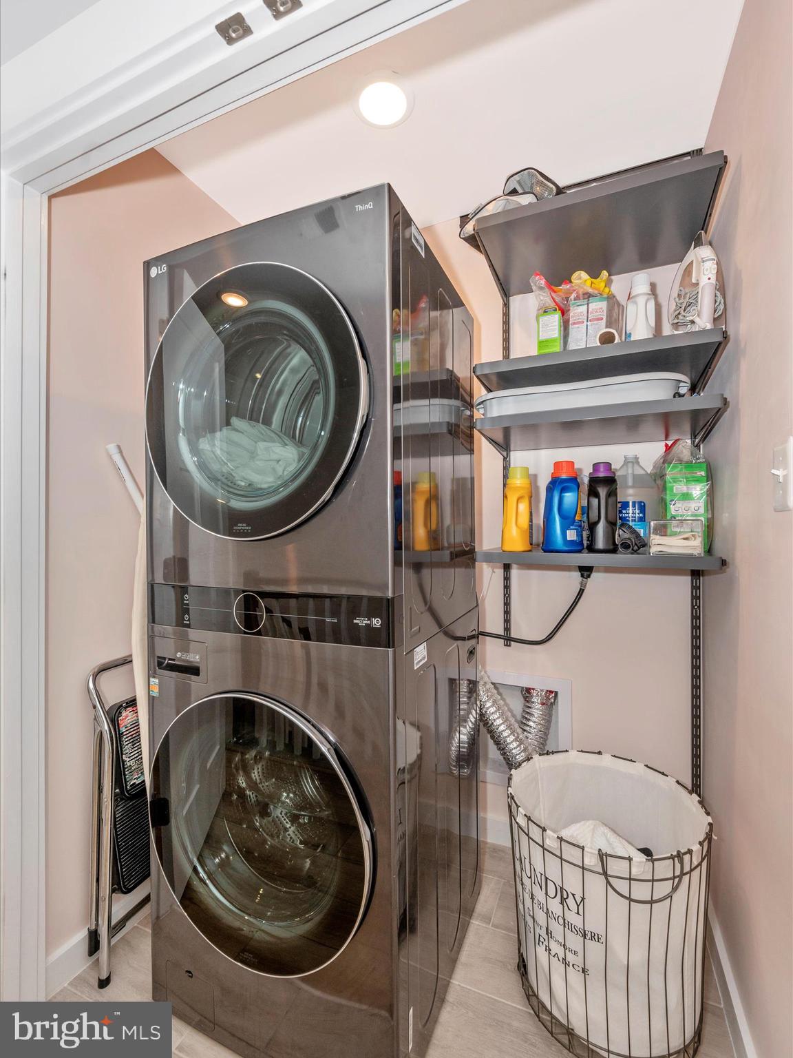 740 Tatum Court Frederick, MD 21702 - Photo 21 of 53 a utility room with dryer washer and a fireplace