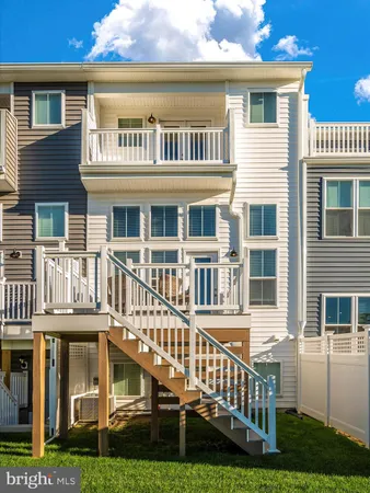 a view of a balcony dining space with furniture