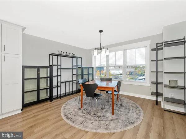 a view of a livingroom with furniture window and wooden floor