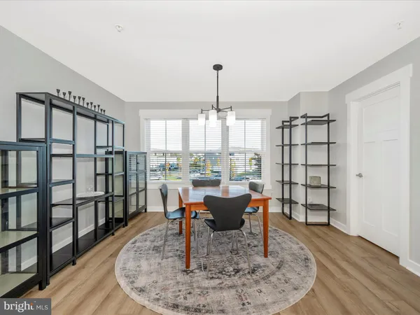 a living room with furniture a rug and a chandelier
