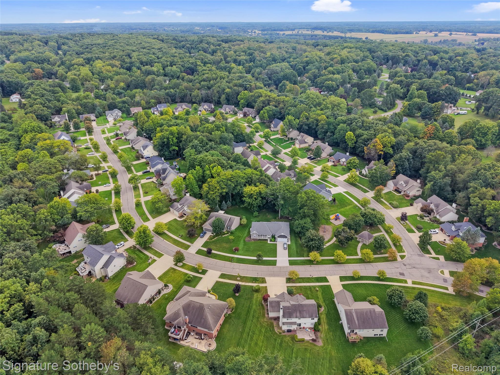 170 Fairhill Way Howell, MI 48843 - Photo 57 of 60 Another view showcasing extensive tree coverage and winding streets