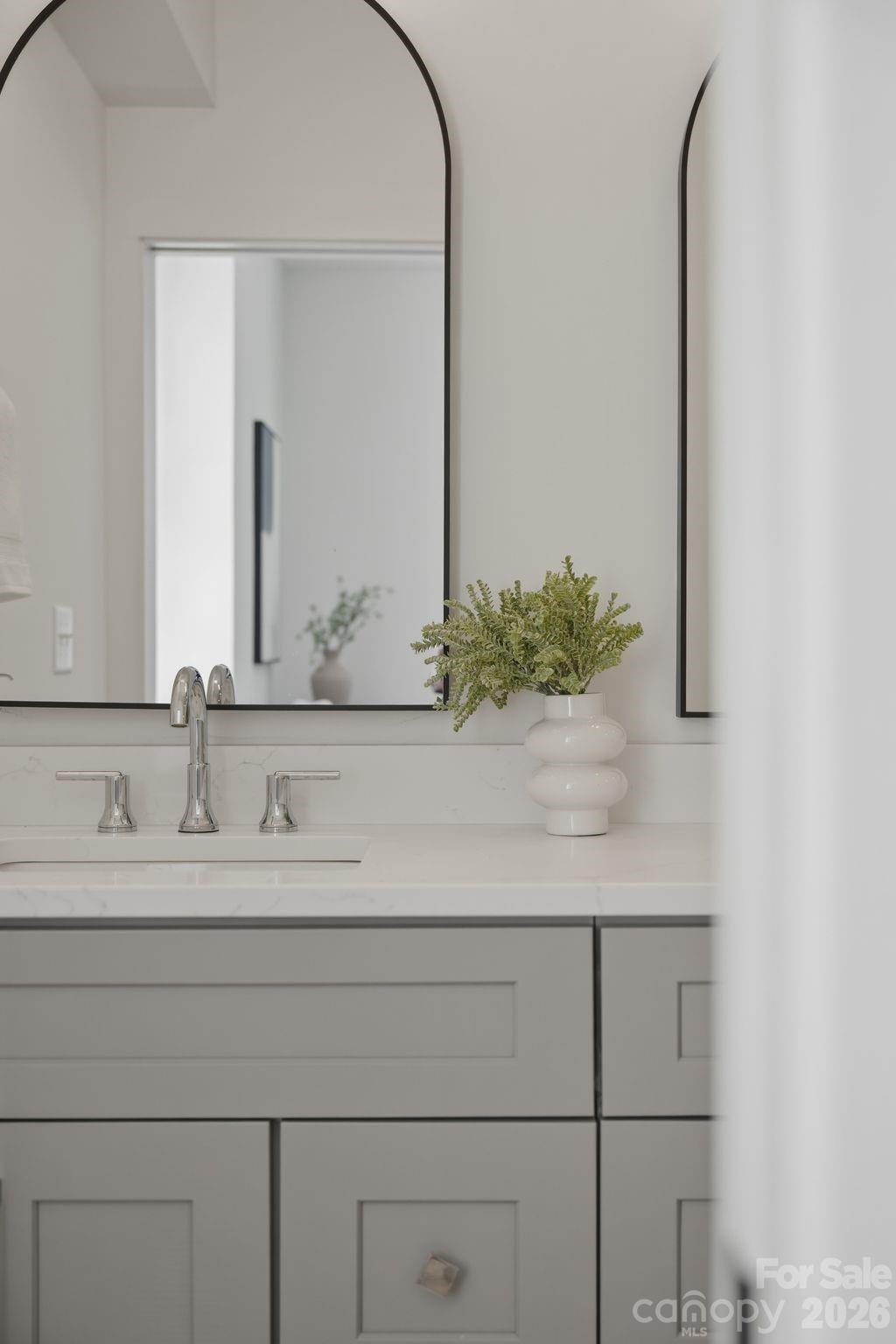 203 Grandin Road, Unit 2 Charlotte, NC 28208 - Photo 32 of 48 a bathroom with a sink and a mirror