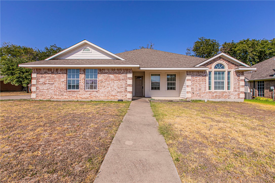 a front view of a house with yard