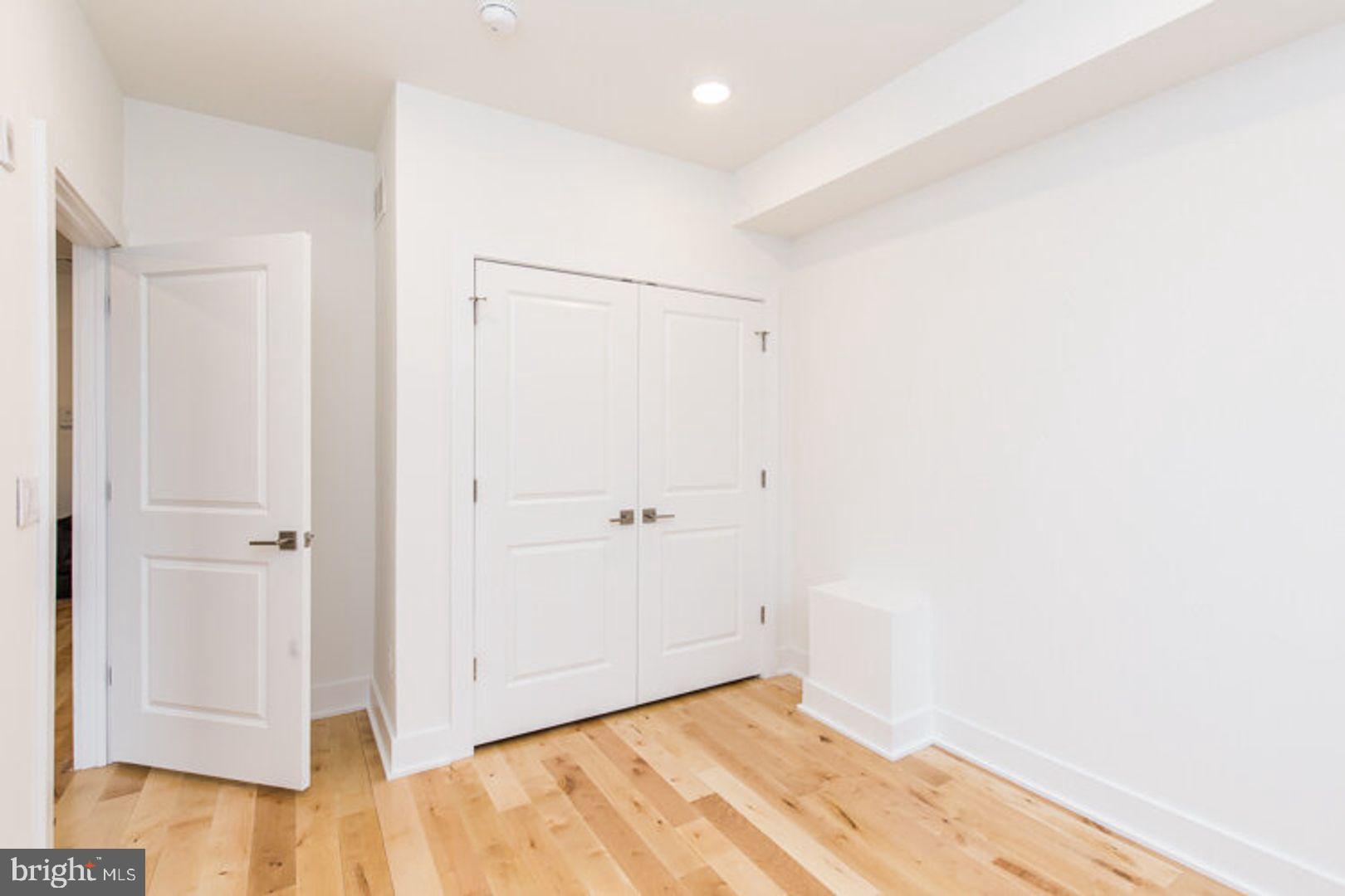 4100 Ludlow Street, Unit 1S Philadelphia, PA 19104 - Photo 10 of 16 a view of a room with wooden floor