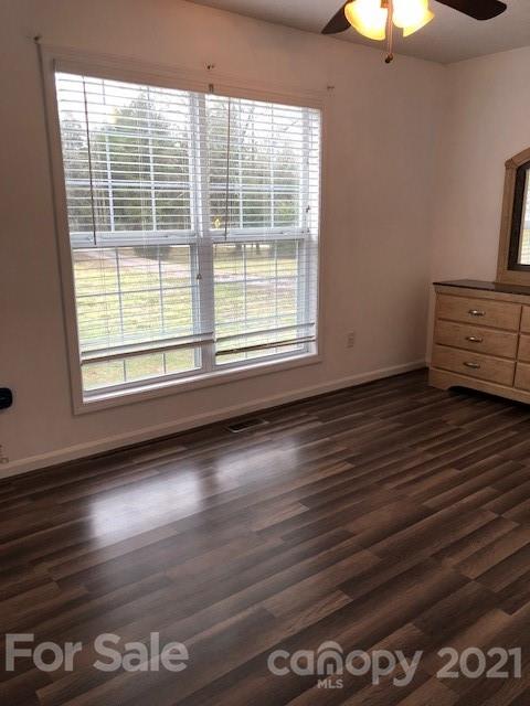 290 Sutton Spring Road York, SC 29745 - Photo 14 of 15 a view of a livingroom with wooden floor and a large window