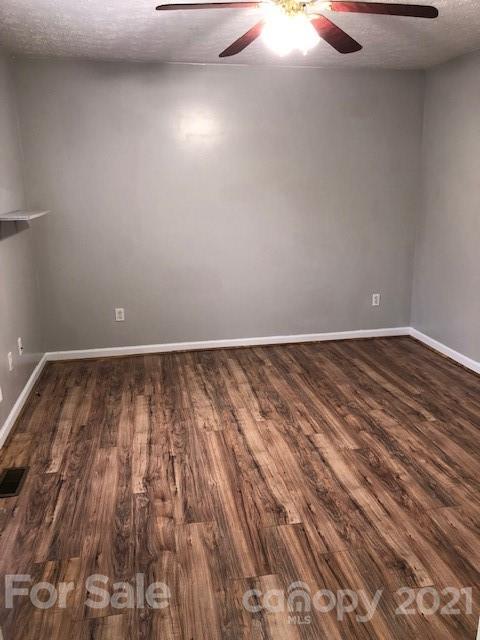 290 Sutton Spring Road York, SC 29745 - Photo 3 of 15 a view of room with wooden floor