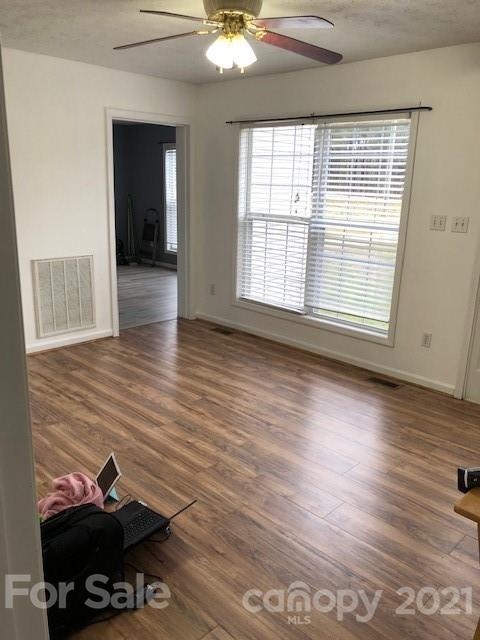 290 Sutton Spring Road York, SC 29745 - Photo 7 of 15 wooden floor in an empty room with a window