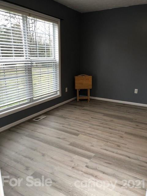 290 Sutton Spring Road York, SC 29745 - Photo 10 of 15 a view of a room with wooden floor and a window