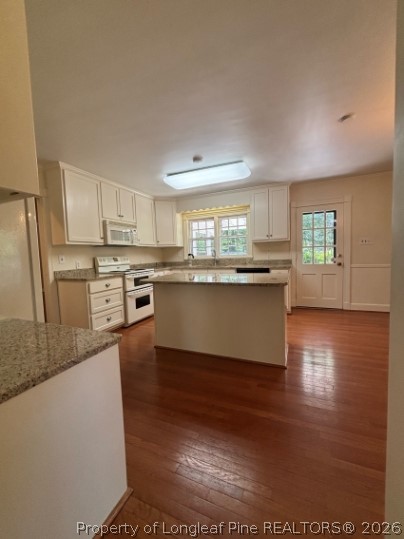 1513 Raeford Road Fayetteville, NC 28305 - Photo 6 of 25 a kitchen with stainless steel appliances granite countertop a stove a sink dishwasher and a refrigerator