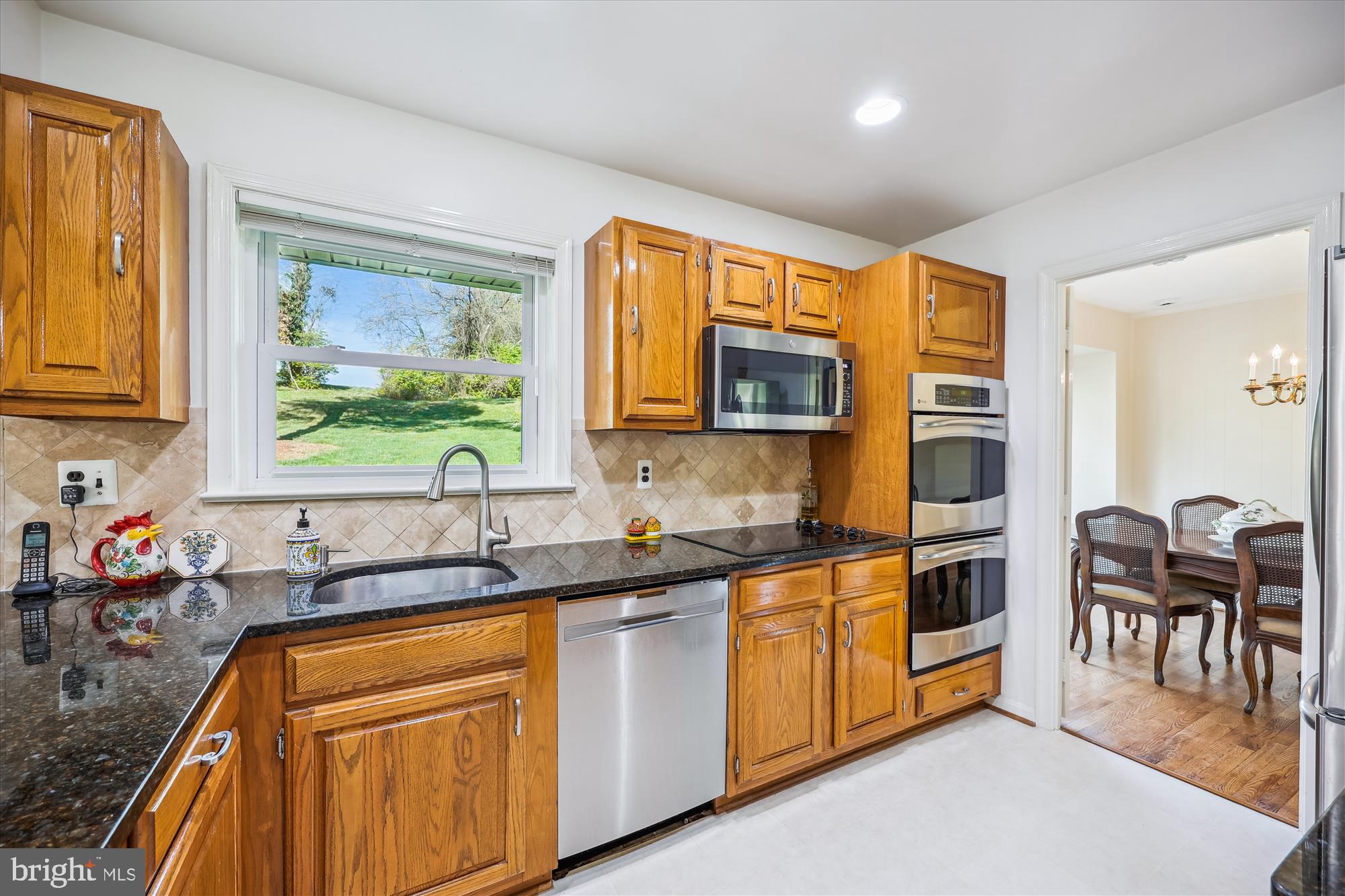 2183 Stratton Drive Potomac, MD 20854 - Photo 11 of 48 a kitchen with stainless steel appliances granite countertop a sink and cabinets