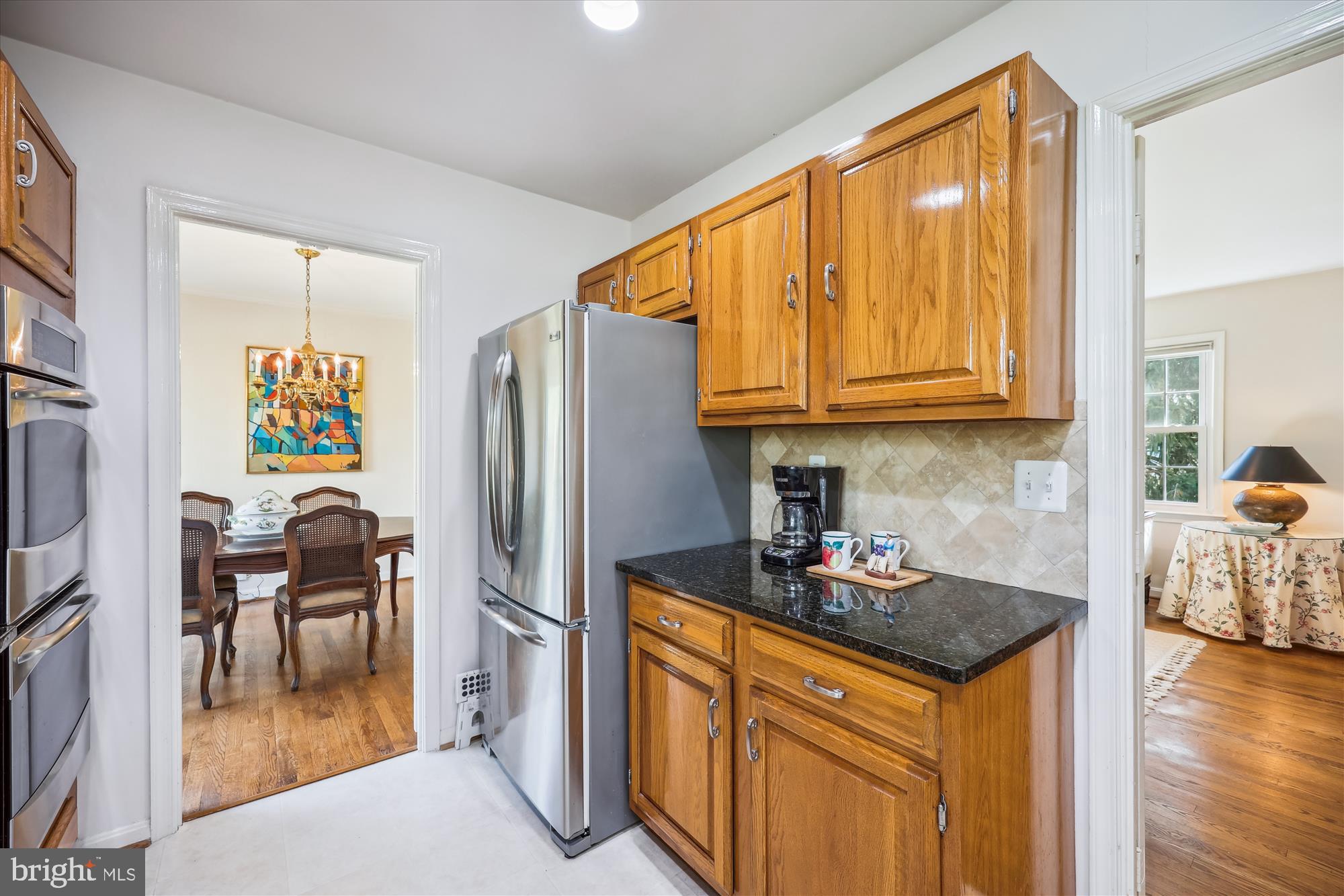 2183 Stratton Drive Potomac, MD 20854 - Photo 13 of 48 a kitchen with stainless steel appliances granite countertop a refrigerator and a stove top oven