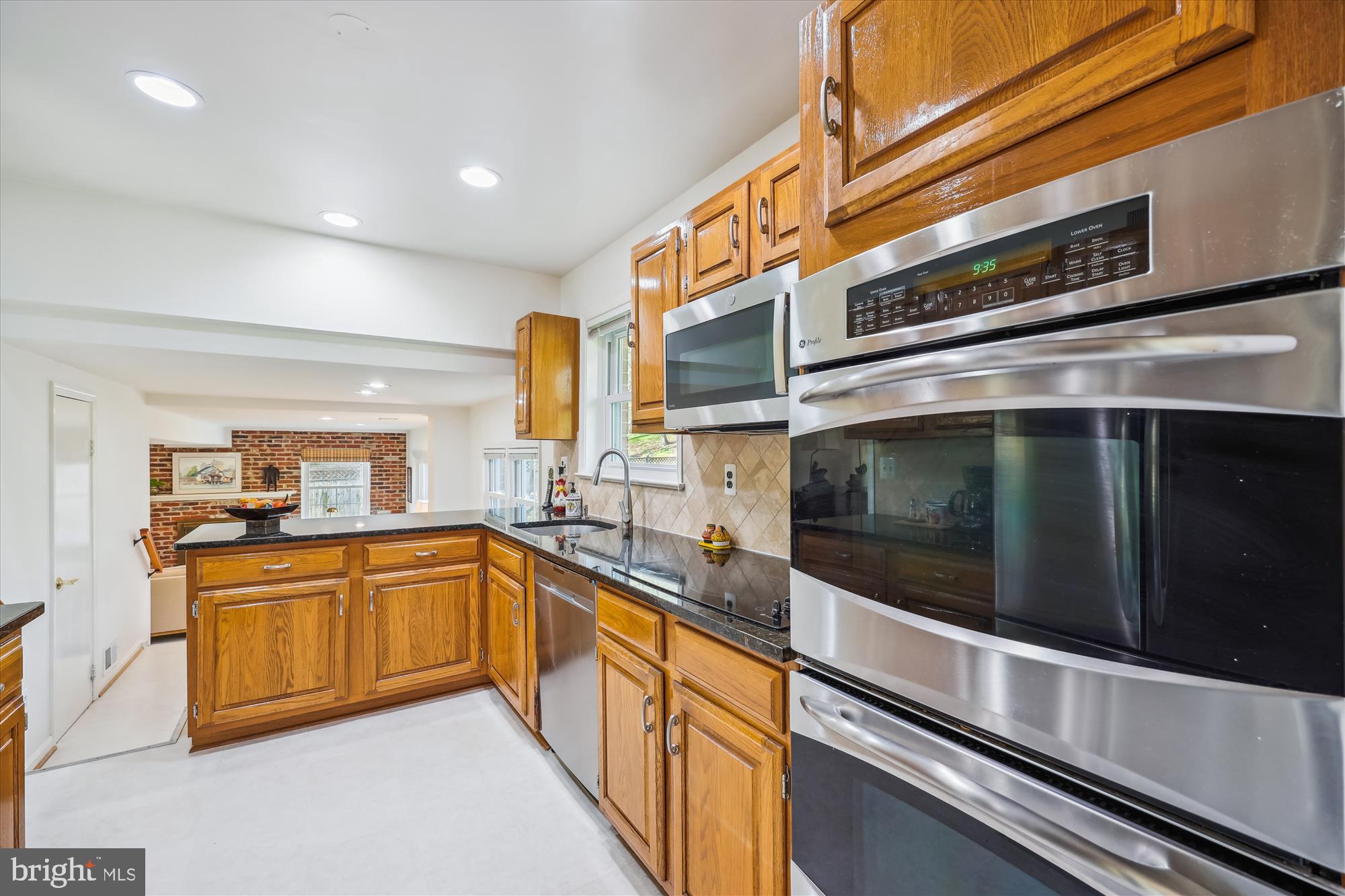 2183 Stratton Drive Potomac, MD 20854 - Photo 14 of 48 a kitchen with stainless steel appliances and sink